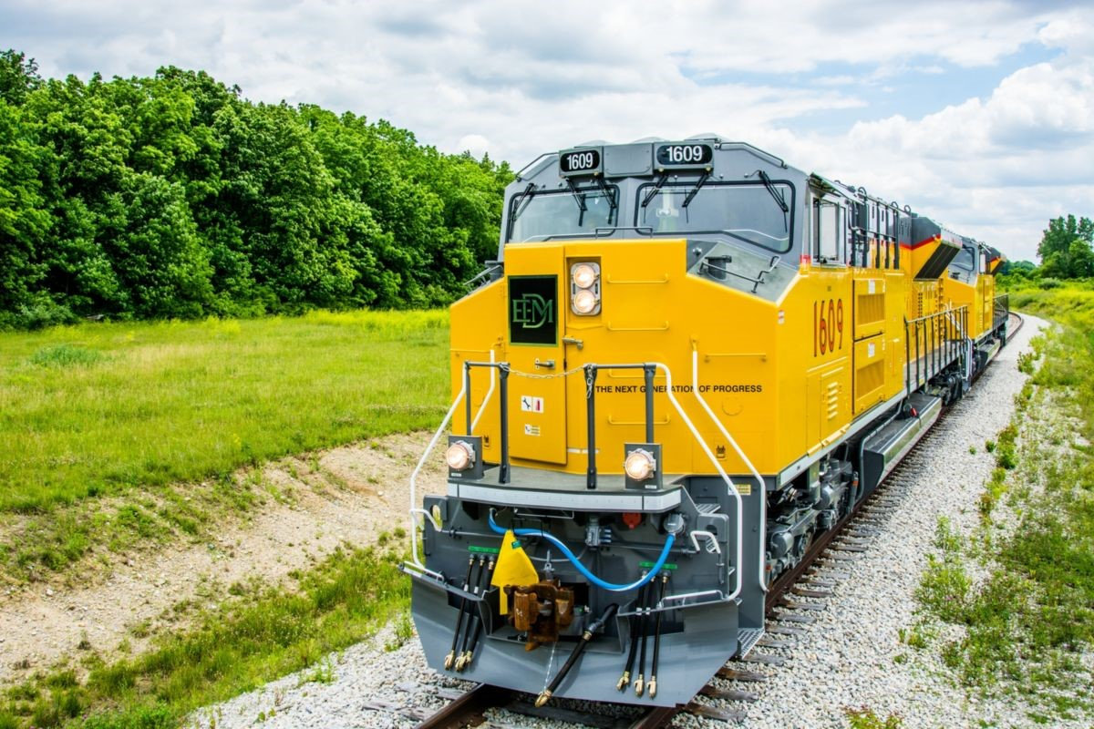 Yellow Train on Train Tracks